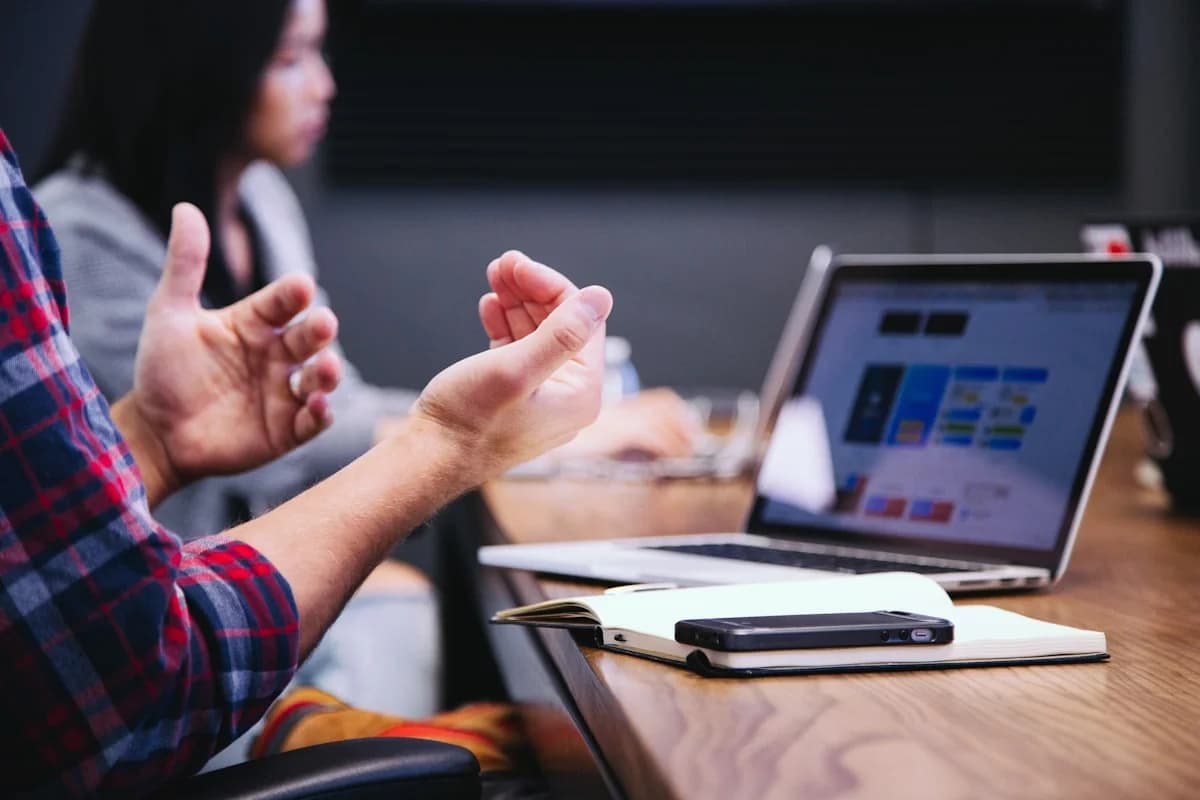 Team collaborating and pointing at a screen