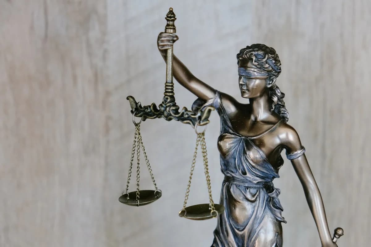 A close-up of a wooden gavel symbolizing the voting and judgment phase in a corporate Mafia game session