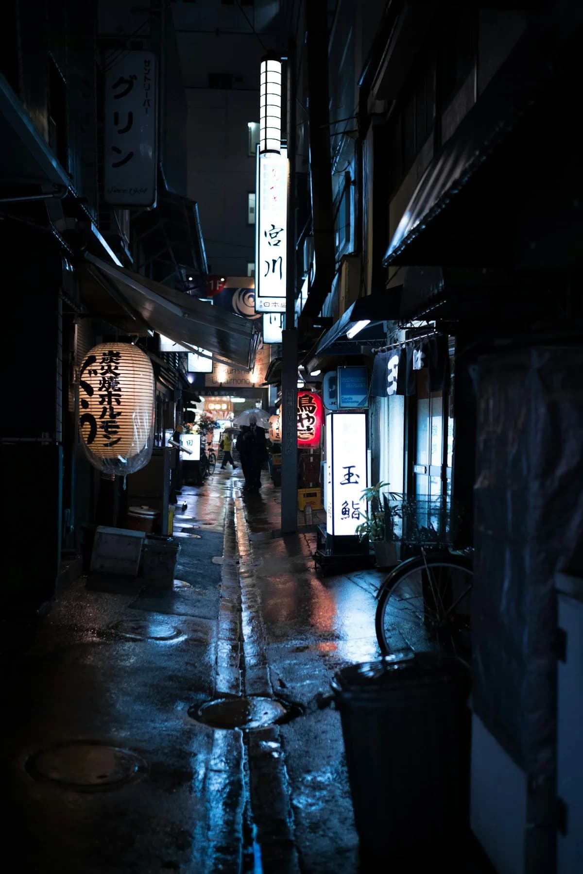 An atmospheric dark cityscape representing the strategic planning and night phase of the Mafia game for office teams
